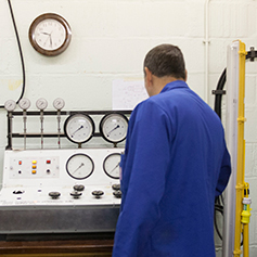 A researcher in the Geotechnics laboratory