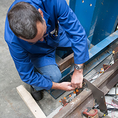 Researcher working with heavy structures equipment