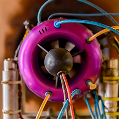 Close up of a magenta coloured jet engine