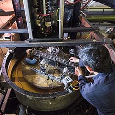 Technician working on rotating water rig