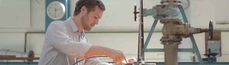 A researcher demonstrating water-based equipment during an open day